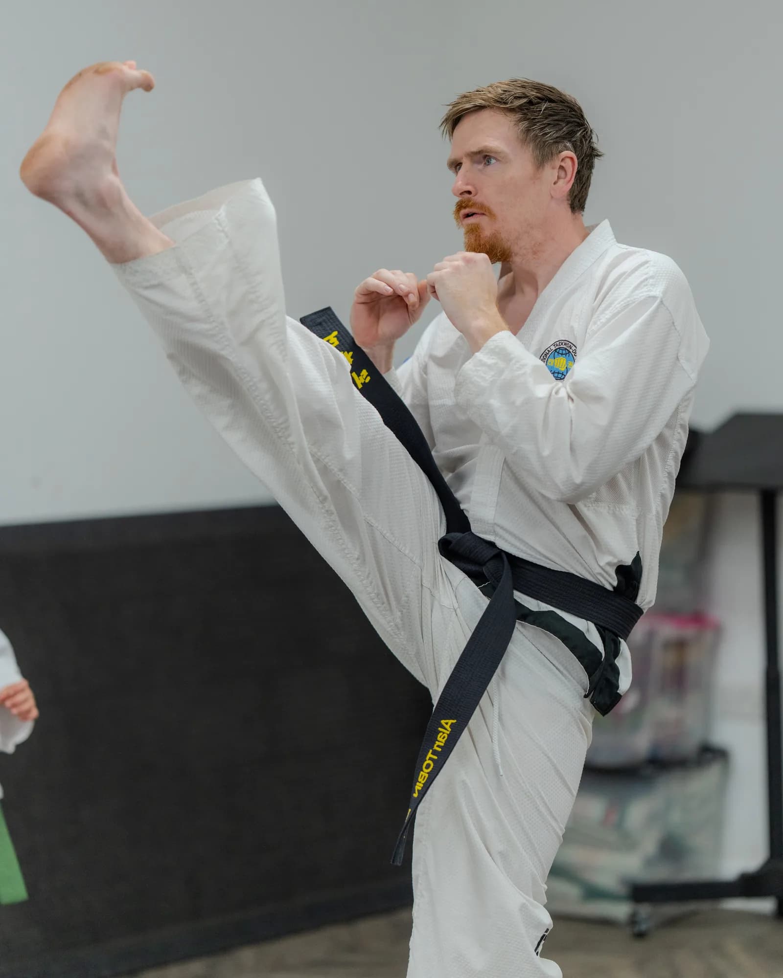 Taekwondo student developing kicking technique