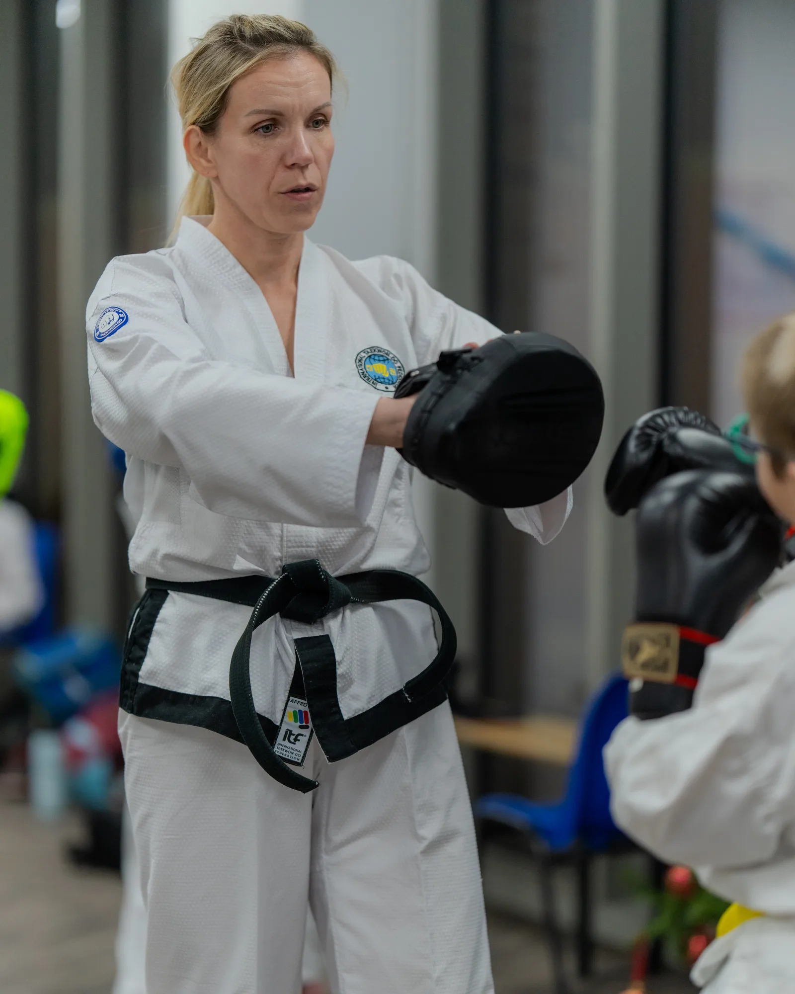 Taekwondo students practising partner drills