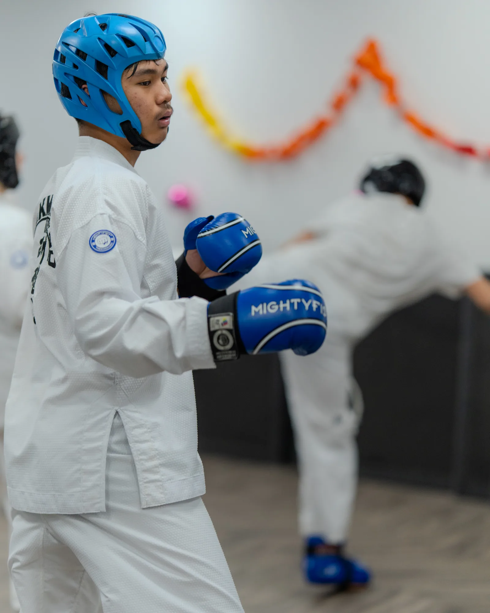 Martial arts students practising controlled sparring